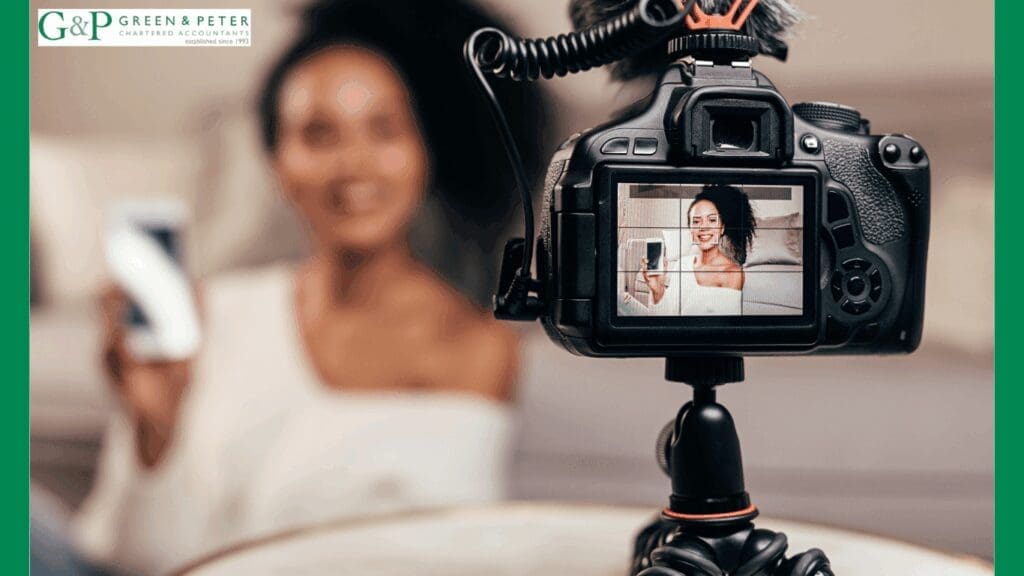 successful woman in front of a digital camera. using an accountant for creative businesses helps you achieve more.