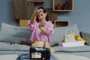 content creator showcasing products on camera, illustrating tax on gifted products for uk influencers and creators.